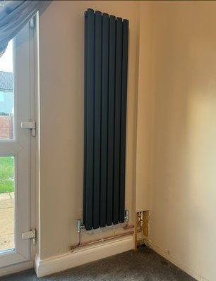 Anthracite vertical designer radiator with new copper feeds